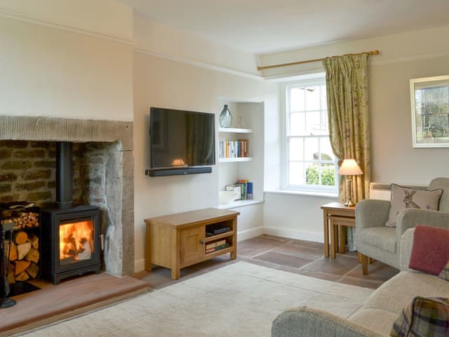 Charming living room with a wood burner | Yan Yak, High Lorton