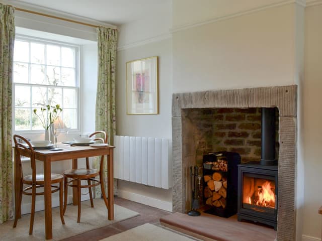 Delightful living/ dining room with a wood burner | Yan Yak, High Lorton