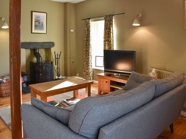 Living room with wood burner | Letterbox Cottage, Far Sawrey