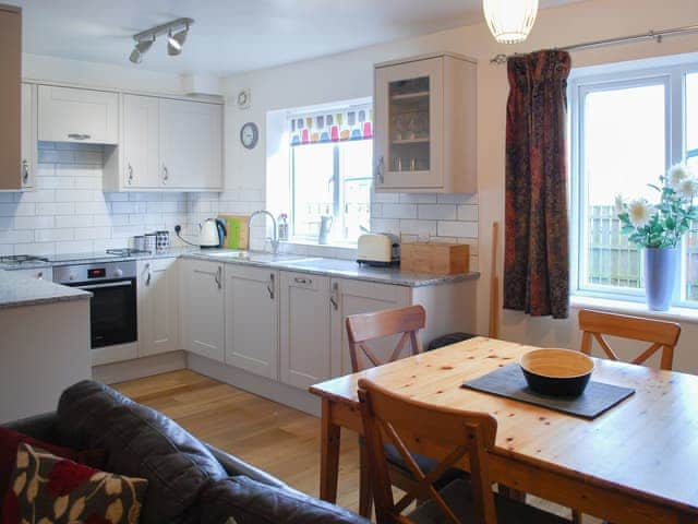 Delightful dining area and adjacent kitchen and living areas | Erskine Cottage, Seahouses