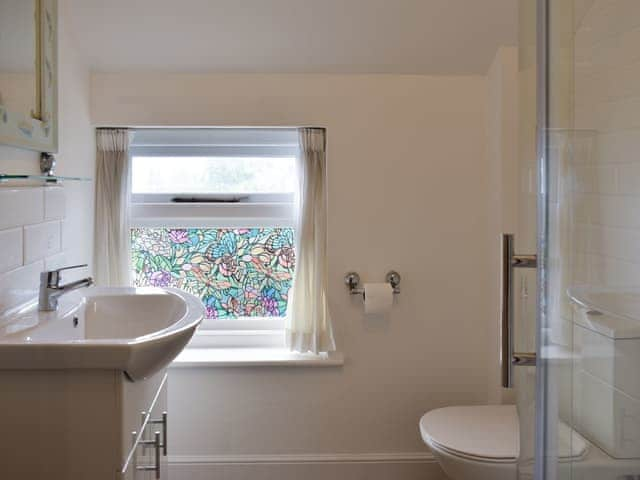 Attractive shower room with stained glass window | Beech Cottage, St Lawrence, near Ventnor