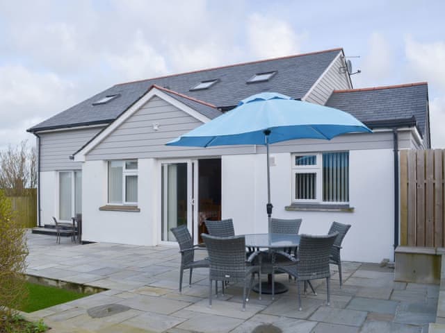 Wonderful paved patio area with table and chairs | Driftwood, Port Isaac