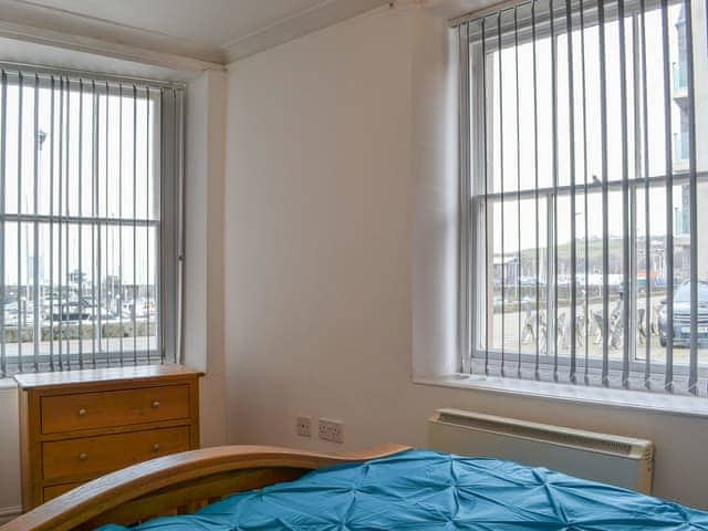 Bedroom with dual aspect views of the harbour | Duncan Square, Whitehaven