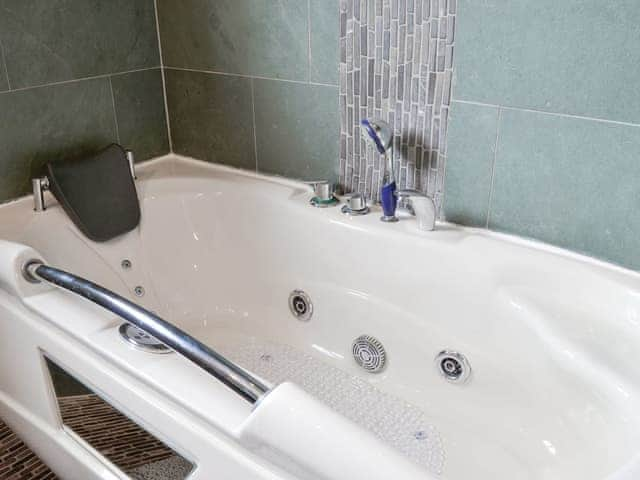 Spa bath within the family bathroom | West Fells Cottage, Rowrah, near Frizington