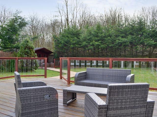 Outdoor furniture on the decked patio | West Fells Cottage, Rowrah, near Frizington