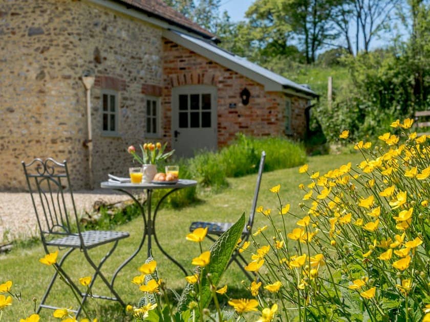 Peaceful garden with outdoor furniture | Mill Cottage, Hawkchurch, near Lyme Regis