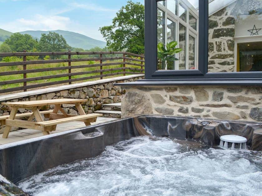 Relaxing hot tub | Ysgoldy Salem - Cewydd Cottages, Cwm-Cewydd, near Machynlleth
