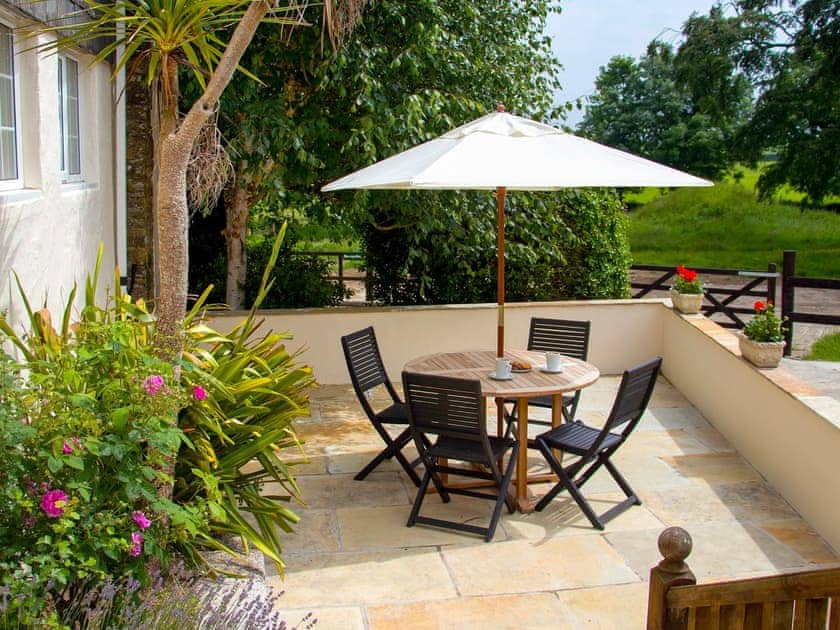 Patio with garden furniture and barbecue | The Shippen - Cartole Cottages, Pelynt, near Looe