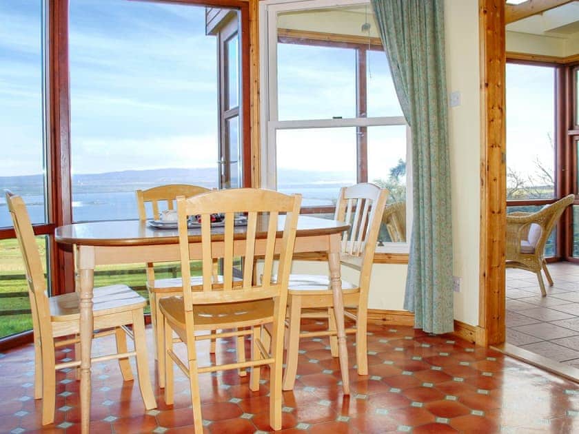 Dining area with stunning views | Callachy Cottage - Flowerburn Holidays, Rosemarkie, near Fortrose