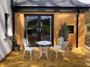 Attractive decked patio | Clarinnes Cottage, Rowardennan, near Loch Lomond