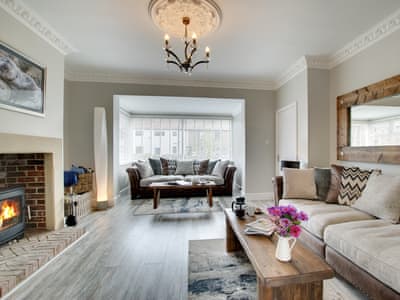 Tastefully furnished living room with wood burner | Amber Waves, Seahouses