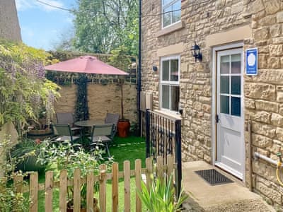 Exterior with access ramp and fenced sitting area | Fawn Lea Cottage, Staindrop, near Barnard Castle