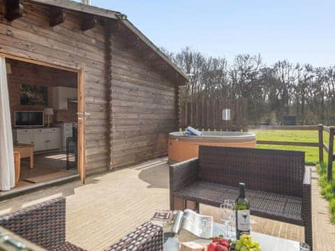 Spacious patio with hot tub and outdoor furniture | Dukes Wood - Readyfields Farm, Caunton, near Newark