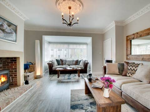 Tastefully furnished living room with wood burner | Amber Waves, Seahouses