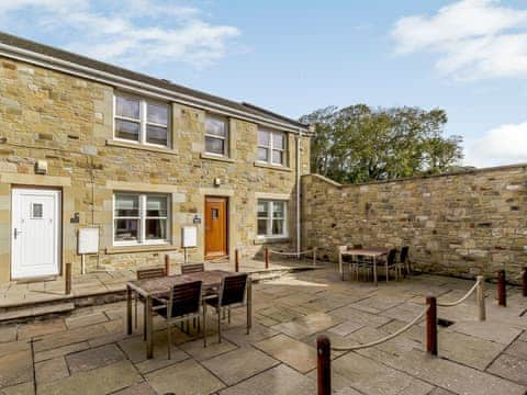 Delightful holiday home with outdoor furniture on the patio | Orchard Sands, Beadnell