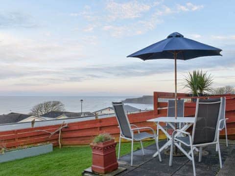 Stunning views from the patio | Sea Views Three - 38 - Sea View Cottages, Knipe Point, near Cayton