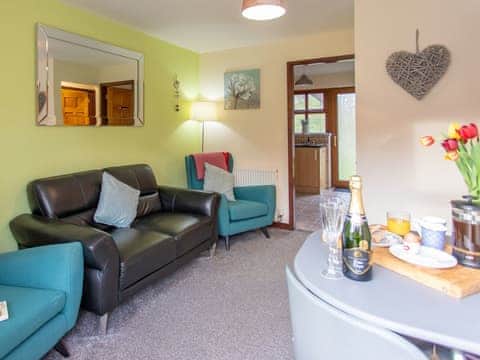 Living room/dining room | Yew Cottage - Graiglwyd Springs Holiday Cottages, Penmaenmawr, near Conwy