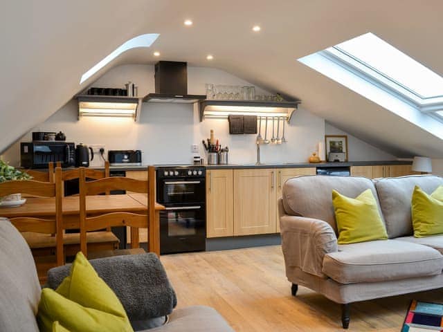 Open plan living space with wooden floor | Apple Barn, Applethwaite, near Keswick