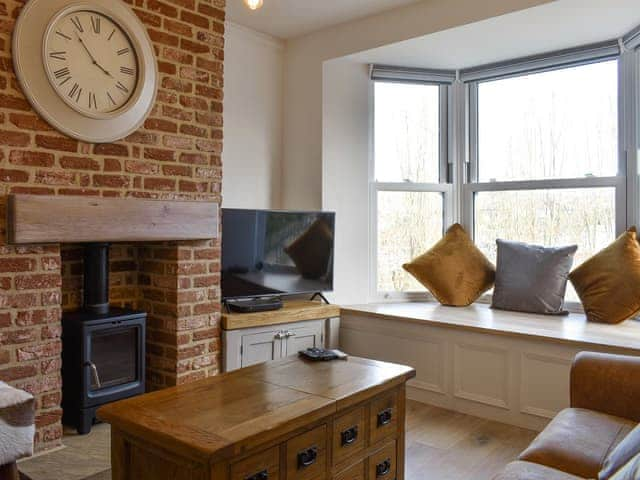 Welcoming living room with wood burner | Abbey View, Whitby