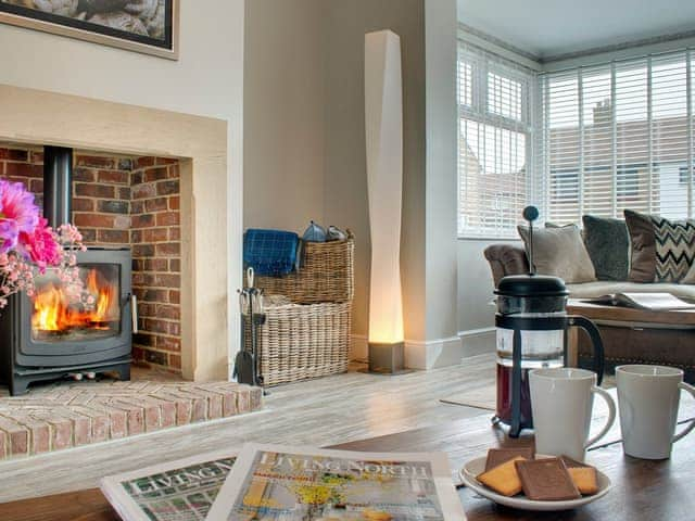 Tastefully furnished living room with wood burner | Amber Waves, Seahouses