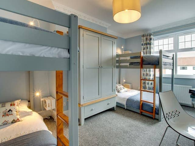 Spacious bedroom with two sets of bunk beds | Amber Waves, Seahouses