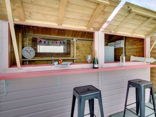 Colourful beach huts | Amber Waves, Seahouses