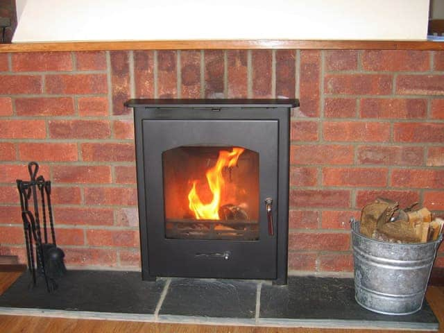 Welcoming living room with cosy wood burner | The Granary - White House Farm Holiday Cottages, Knapton, near North Walsham