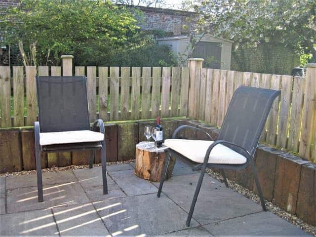 Relaxing patio area | The Granary - White House Farm Holiday Cottages, Knapton, near North Walsham