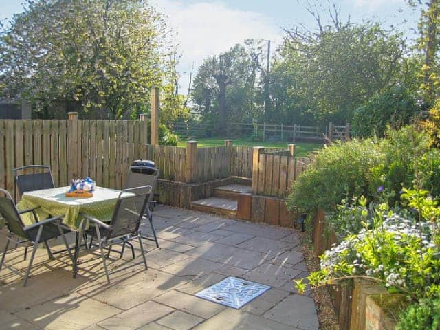 Inviting patio | Wallages Cottage - White House Farm Holiday Cottages, Knapton, near North Walsham