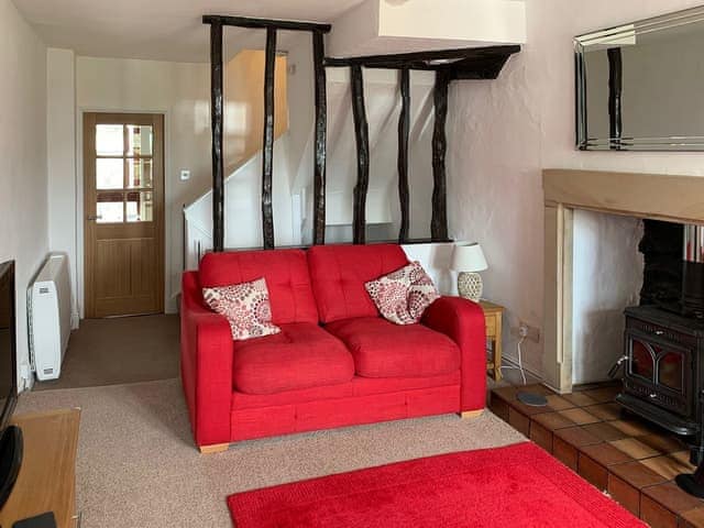 Cosy, beamed living room with wood burning stove | Rock Cottage, Crosthwaite