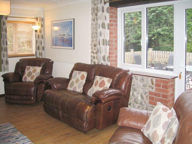 Welcoming living room with cosy wood burner | The Granary - White House Farm Holiday Cottages, Knapton, near North Walsham