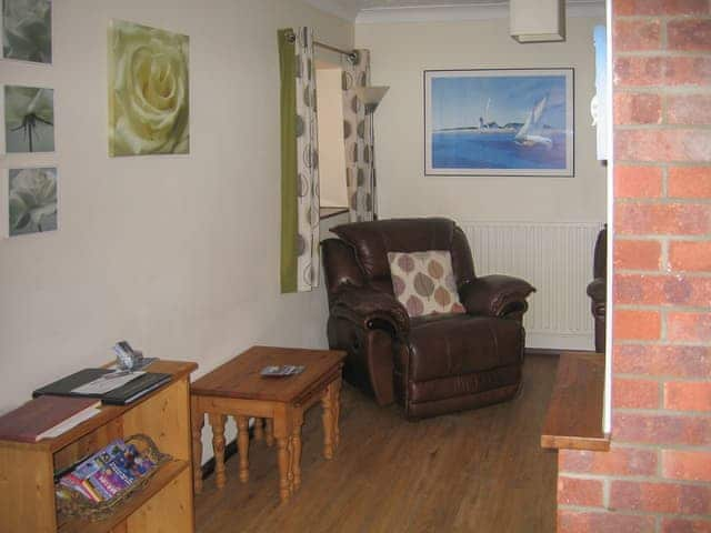 Welcoming living room with cosy wood burner | The Granary - White House Farm Holiday Cottages, Knapton, near North Walsham