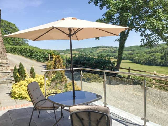 Relaxing patio area with shaded seating | Orchard Close - Sanctuary Farm Cottages, Morwenstow, near Bude