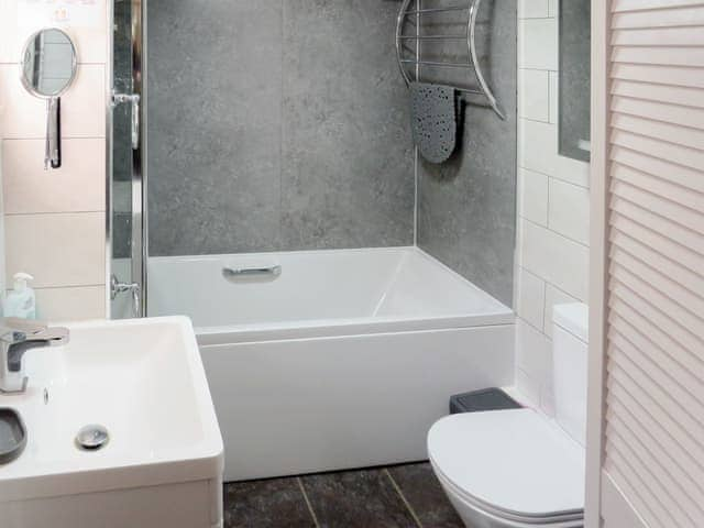 Bathroom with shower over the bath | Trenay Barn Cottage, St Neot, near Liskeard