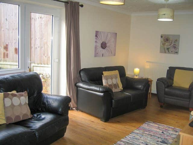 Spacious living room with wood burner | Wallages Cottage - White House Farm Holiday Cottages, Knapton, near North Walsham