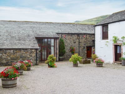 Blencathra isright in the middle of the image with the little brown door | Blencathra - Blakebeck Farm, Mungrisdale, near Threlkeld