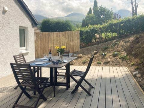 Decked patio area with spectacular views of the mountains | Sonas, Torlundy