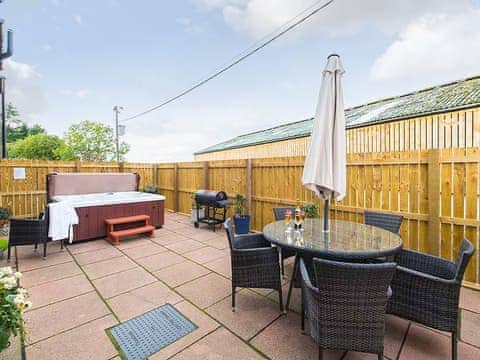 Outdoor area with hot tub | The Old Byre - Rossie Ochil Estate, Forgandenny