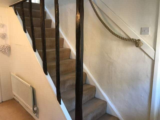 Partial, open-sided stairs to first floor with rope hand rail | White Horse Cottage, West Meon, near Petersfield