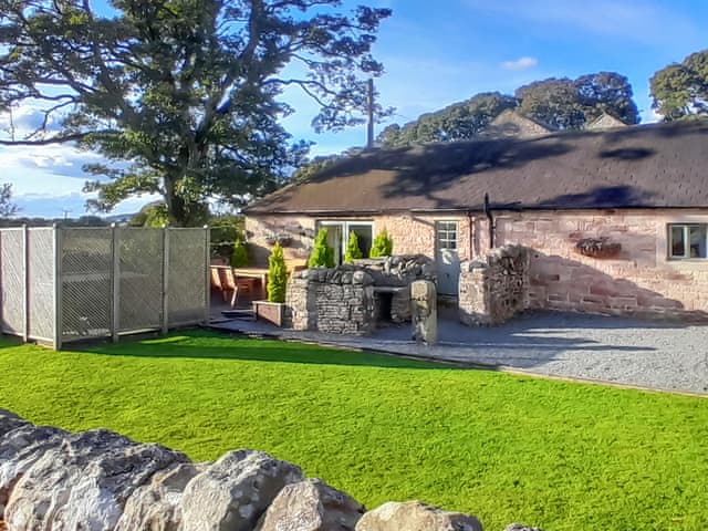Decked patio area with seating and hot tub | Lily Rose Cottage, Gilsland, near Brampton