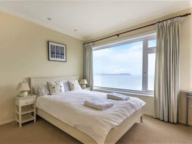 Master bedroom with a sea view | The Sea House, Portscatho