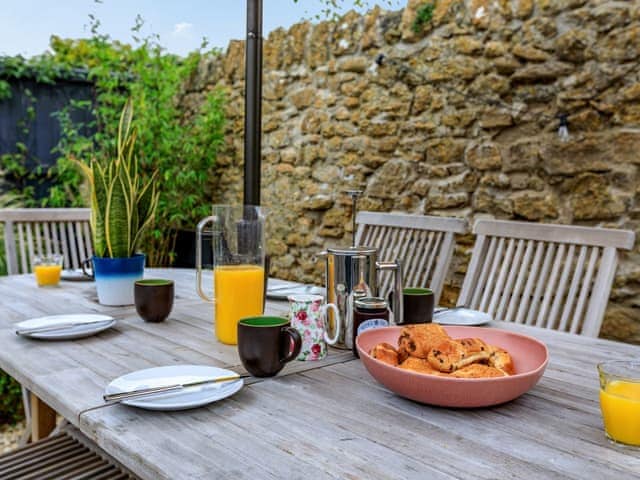 Outdoor eating area | Coach House - Bradstock Cottages, Burton Bradstock, near Bridport