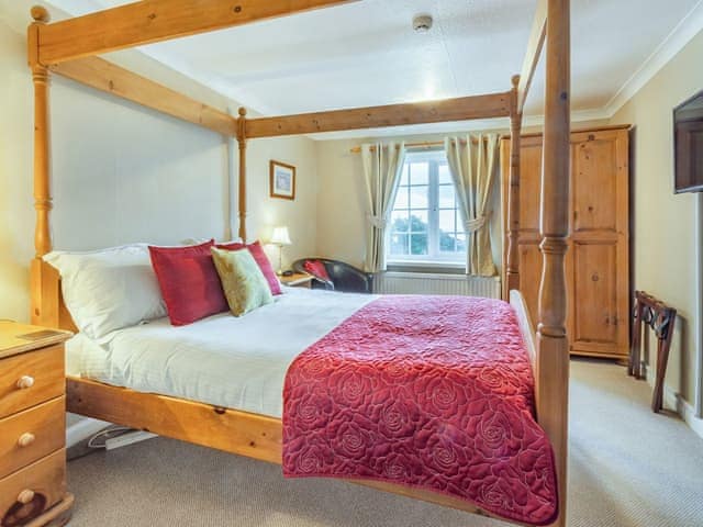 Four Poster bedroom | Smugglers Rock House, Ravenscar, near Robin Hoods Bay