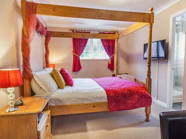 Four Poster bedroom | Smugglers Rock House, Ravenscar, near Robin Hoods Bay