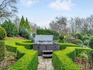 Garden with hot tub | Old Upper Gwestydd, Newtown