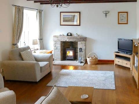 Comfortable living room with wood burner | Sweet Pea Cottage, Redmire, near Leyburn