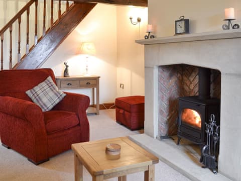 Cosy living room with wood burner | Far Barsey Cottage, Barkisland, near Halifax