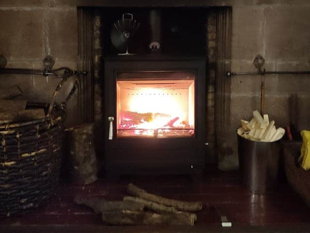 Warming wood burner | Whitehall Pele Tower, Mealsgate