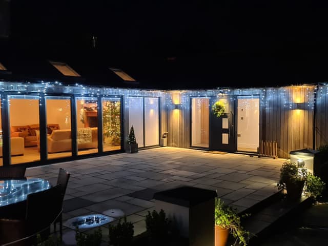 Outdoor area illuminate in the evening | Farmhouse Cottage - Colley Mill Farm, North Rode