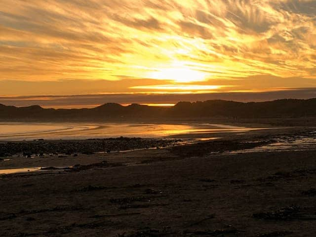 Winter sunset at low tide on Beadnell Beach | Sea Winnings, Beadnell